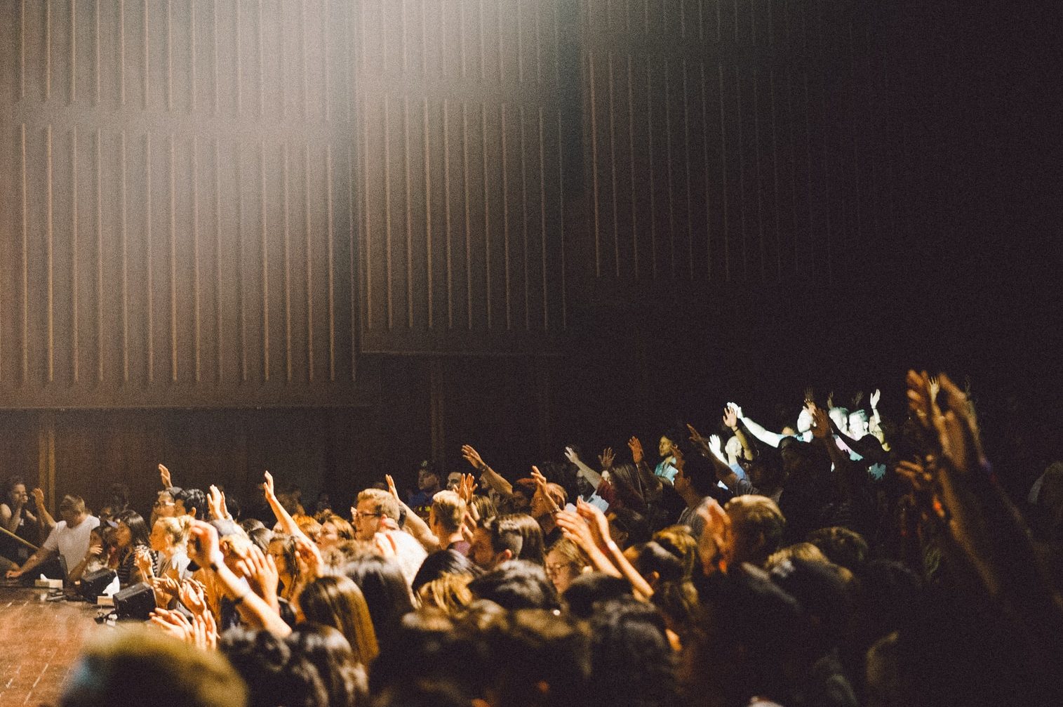 people raising their hands